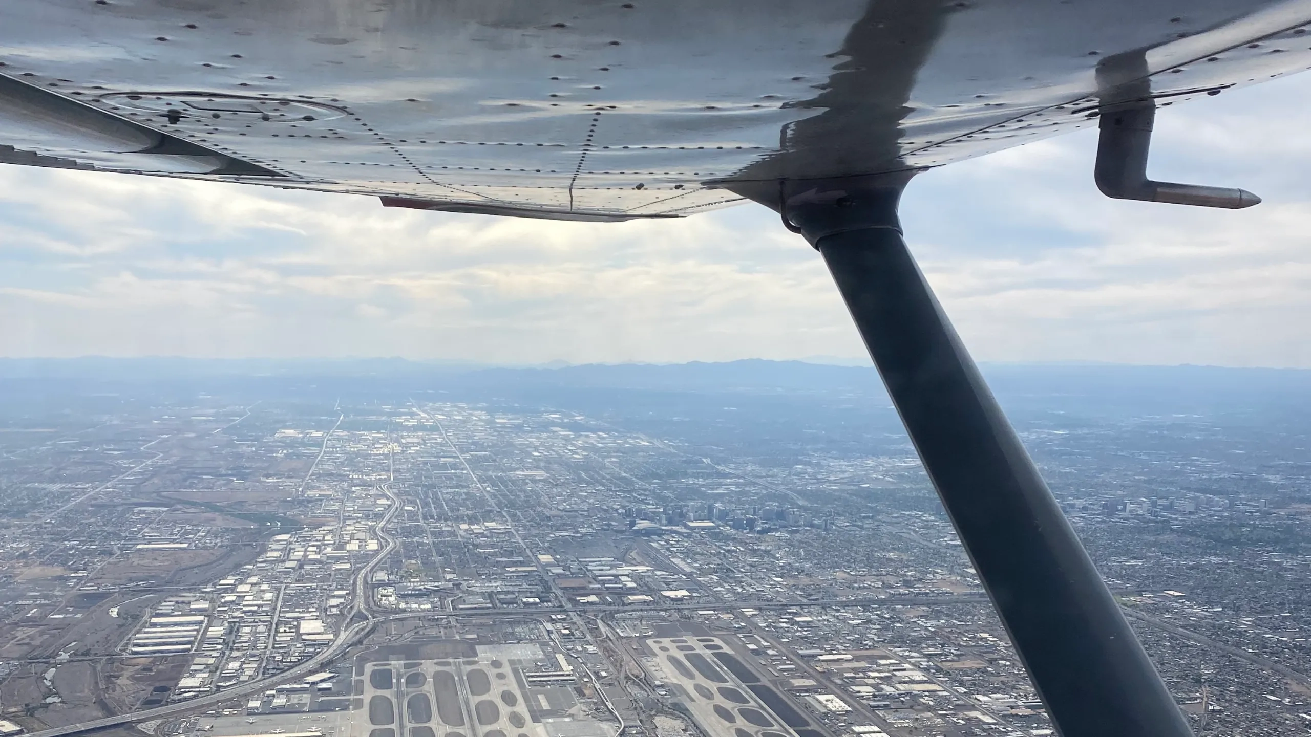 Phoenix Sky Harbor International Airport seen from under the wing of a SimpliFly Flight School Cessna
