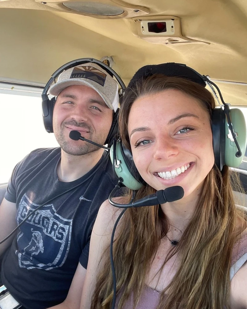 sun city aviation founder luke poulos in front of a sun city airplane