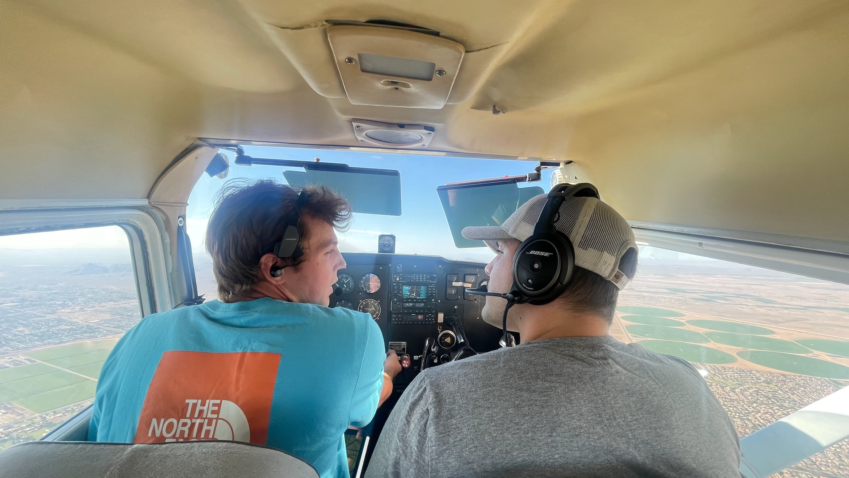 SimpliFly Flight School student and flight instructor in a Cessna airplane cockpit
